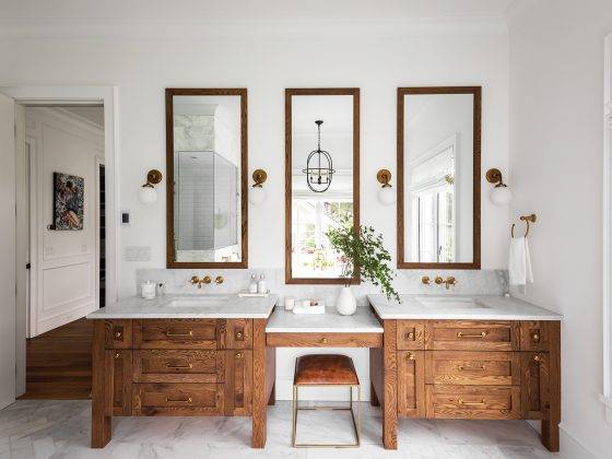Interior of a sleek modern bathroom with double vanity.