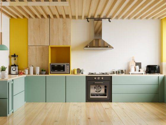 Mid century modern kitchen with green cabinets and cream and yellow walls